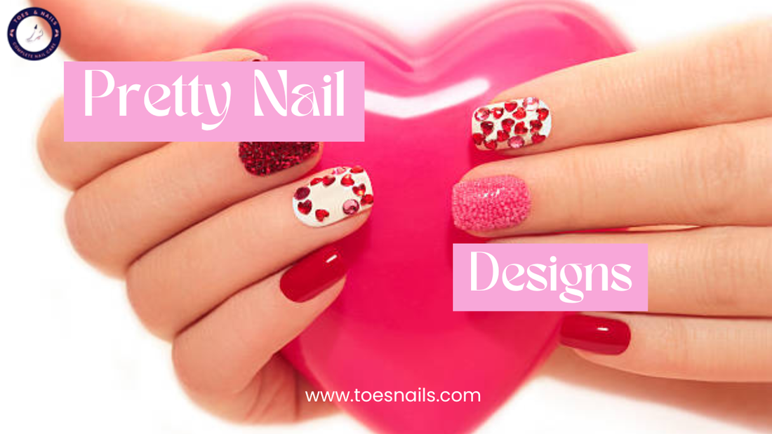 Hands with red and pink glitter nail designs holding a pink heart