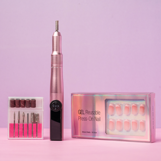 Pink NailPro Duo electric nail drill with drill bits and a reusable press-on nail kit